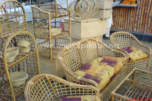Cane chairs on sale in a small festival