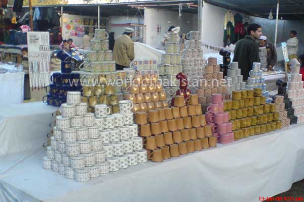 Mugs being sold in a small festival